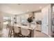 Spacious kitchen featuring a central island, modern lighting, and an open design at 2277 Crossbow St, Clermont, FL 34715