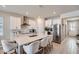 Modern kitchen boasts a large island, stainless steel appliances, and sleek white cabinets at 2277 Crossbow St, Clermont, FL 34715