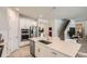 Well-appointed kitchen with stainless steel appliances, white cabinetry, and a stylish backsplash at 2277 Crossbow St, Clermont, FL 34715