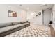 Inviting living room with plush sectional and a stylish rug, perfect for relaxation and entertaining at 2277 Crossbow St, Clermont, FL 34715