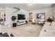 Bright and airy living room featuring modern decor, neutral tones, and ample natural light at 2277 Crossbow St, Clermont, FL 34715