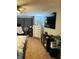 Bedroom with carpet, neutral walls, a ceiling fan, a large dresser, and a mounted TV at 2285 Seven Oaks Dr, St Cloud, FL 34772