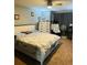 Bedroom with carpet, ample natural light, neutral walls, a ceiling fan, and modern decor at 2285 Seven Oaks Dr, St Cloud, FL 34772