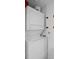 Efficient laundry room featuring stacked washer and dryer for space-saving convenience at 231 Riverside Dr # 708, Daytona Beach, FL 32117