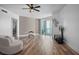 Contemporary living room boasting stylish decor, wood floors, and access to a balcony at 231 Riverside Dr # 708, Daytona Beach, FL 32117