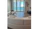 Bright living room features an oversized window with gorgeous water views at 231 Riverside Dr # 708, Daytona Beach, FL 32117