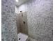 Tiled shower with chrome fixtures and a modern showerhead at 231 Riverside Dr # 708, Daytona Beach, FL 32117