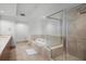 Well-lit bathroom features a soaking tub, shower, and a clean, modern design at 231 Riverside Dr # 708, Daytona Beach, FL 32117
