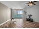 Bright living room with wood floors, fan, furniture, and beautiful water view at 231 Riverside Dr # 708, Daytona Beach, FL 32117