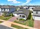 Aerial view showcasing a charming one-story home with a beautiful yard, nestled in a friendly and well-planned neighborhood at 2311 Bear Peak Road, Minneola, FL 34715