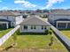 Spacious fenced-in backyard, perfect for outdoor activities and gatherings, offering privacy and room to play in a well-kept setting at 2311 Bear Peak Road, Minneola, FL 34715