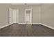 Empty bedroom with doors leading to other rooms at 2311 Bear Peak Road, Minneola, FL 34715