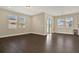 Bright living area with large windows and sliding glass doors to the outside at 2311 Bear Peak Road, Minneola, FL 34715