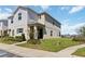 Inviting two-story home with manicured lawn and attractive landscaping at 233 Primrose Dr, Davenport, FL 33837