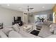 Comfortable living room with tile floors, fan, and view to the outdoor area with sliding glass doors at 233 Primrose Dr, Davenport, FL 33837