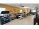 Open-concept living area with tile floors, ceiling fan, and direct access to the dining and kitchen areas at 233 Primrose Dr, Davenport, FL 33837