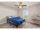 Bedroom with ceiling fan and natural light at 2412 Twin Lake View Rd, Winter Haven, FL 33881