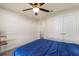 Bedroom with ceiling fan and closet at 2412 Twin Lake View Rd, Winter Haven, FL 33881