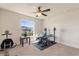 Bedroom featuring desk, weight-lifting equipment, ceiling fan, and natural light at 2412 Twin Lake View Rd, Winter Haven, FL 33881