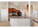 Open kitchen layout with modern appliances, tile backsplash, granite countertops, and a breakfast bar at 2412 Twin Lake View Rd, Winter Haven, FL 33881