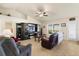 Inviting living room with tile flooring, plenty of seating, natural light, and a view to the backyard at 2412 Twin Lake View Rd, Winter Haven, FL 33881