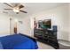 Spacious main bedroom featuring walk-in closets, natural light, neutral paint, and easy access to the en-suite at 2412 Twin Lake View Rd, Winter Haven, FL 33881