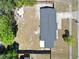 An aerial shot displays the home's backyard, roof, and the surrounding lot and neighborhood at 2480 Alamanda Ave, Deltona, FL 32738