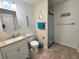 Bathroom features a vanity, toilet, tub/shower with neutral walls and tile flooring at 2480 Alamanda Ave, Deltona, FL 32738