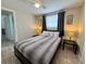 Comfortable bedroom featuring a ceiling fan and natural light, perfect for a relaxing retreat at 2480 Alamanda Ave, Deltona, FL 32738