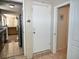 Hallway with white doors and neutral paint leads to different areas of the home at 2480 Alamanda Ave, Deltona, FL 32738
