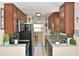 Well-lit kitchen featuring modern appliances and stylish backsplash at 2480 Alamanda Ave, Deltona, FL 32738
