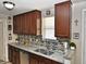 Renovated kitchen featuring granite countertops and stainless steel appliances at 2480 Alamanda Ave, Deltona, FL 32738