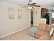 Comfortable living room with a neutral color palette, tile floors, and lots of natural light at 2480 Alamanda Ave, Deltona, FL 32738