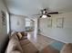 Inviting living room featuring comfortable seating and great natural light with an open floor plan at 2480 Alamanda Ave, Deltona, FL 32738