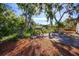 Spacious backyard featuring brick patio and a landscaped yard offering privacy and tranquility at 2713 Lime Tree Dr, Edgewater, FL 32141