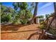 Shaded backyard oasis featuring a swing and ample space for outdoor dining and relaxation at 2713 Lime Tree Dr, Edgewater, FL 32141