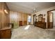 Bedroom with wood paneling, carpeted floors, and natural light at 2713 Lime Tree Dr, Edgewater, FL 32141
