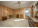 Bedroom with wood paneling, carpeted floors, and natural light at 2713 Lime Tree Dr, Edgewater, FL 32141