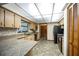 Bright kitchen features stone countertops, wood cabinets, and stainless steel appliances at 2713 Lime Tree Dr, Edgewater, FL 32141