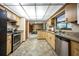 Open kitchen with stone countertops, wood cabinets, and stainless steel appliances at 2713 Lime Tree Dr, Edgewater, FL 32141