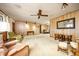 Spacious living room with paneled walls, carpet flooring, and comfortable seating arrangements at 2713 Lime Tree Dr, Edgewater, FL 32141