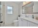 Updated bathroom featuring a modern vanity with quartz countertop, framed mirror and neutral wall color at 2732 Lion Heart Rd, Winter Park, FL 32792