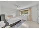 Bright bedroom with natural light, neutral decor, a white dresser, and wood-framed windows at 2732 Lion Heart Rd, Winter Park, FL 32792