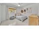 Cozy bedroom with neutral decor, bright light, a wood dresser, and a peaceful atmosphere at 2732 Lion Heart Rd, Winter Park, FL 32792