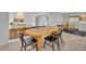 Stylish dining area with a wooden table, modern chairs, and seamless flow into the living space at 2732 Lion Heart Rd, Winter Park, FL 32792