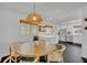 Modern eat-in kitchen features stainless steel appliances, white cabinetry, and natural light at 2732 Lion Heart Rd, Winter Park, FL 32792