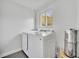 Functional laundry room with front-load washer and dryer and a window providing natural light at 2732 Lion Heart Rd, Winter Park, FL 32792