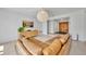Bright living room with a brown sectional couch, stylish decor, and an open layout at 2732 Lion Heart Rd, Winter Park, FL 32792