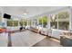 Spacious sunroom with hardwood floors, natural light, and plenty of room for activities at 2732 Lion Heart Rd, Winter Park, FL 32792