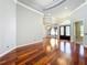 Open living room featuring hardwood floors, a chandelier, and a view into the entry way at 2816 Northampton Ave, Orlando, FL 32828